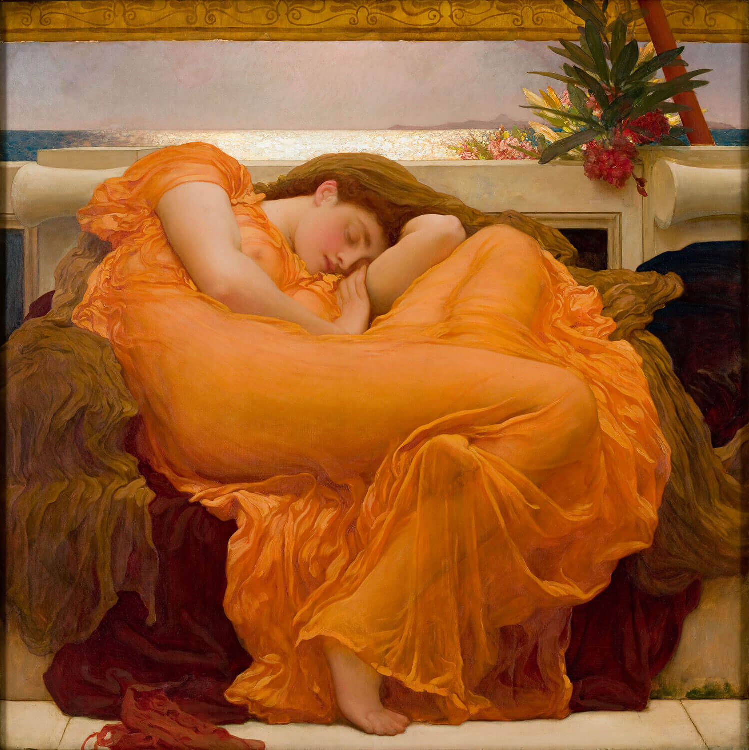 Woman in an orange dress lying on a couch with decorative elements in the background